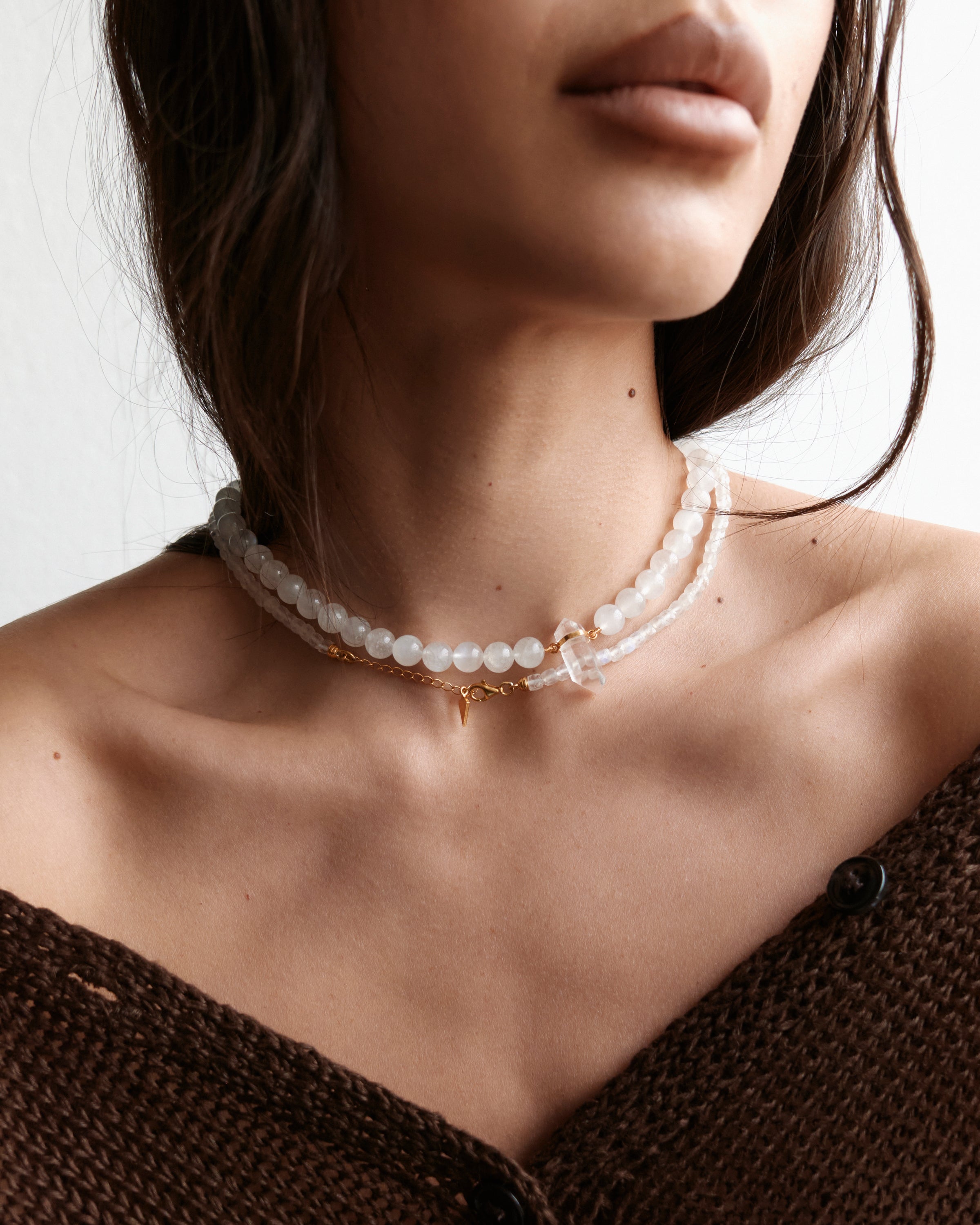 ETERNA / ENCARA LUNOR Moonstone necklaces with raw polished quartz point pendant, gold 8 cm extension chain and clasp, arrowhead-shaped fantasy signature, 4 mm and 8 mm faceted moonstone bead strand.